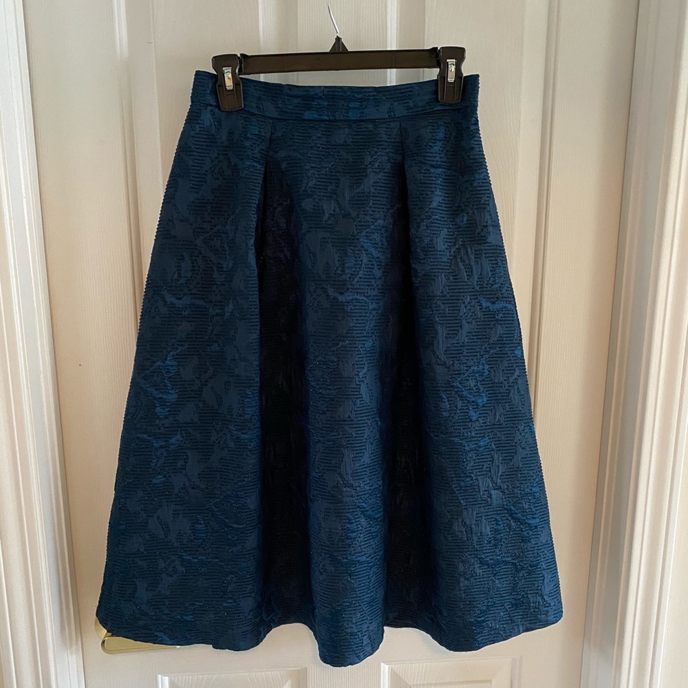 Turquoise blue pleated circle skirt